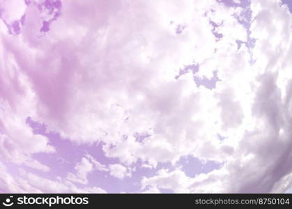 A blue sky with lots of white clouds of different sizes. Fisheye photo. A blue sky with lots of white clouds of different sizes. Fisheye