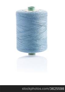 a bobbin with gray sewing string