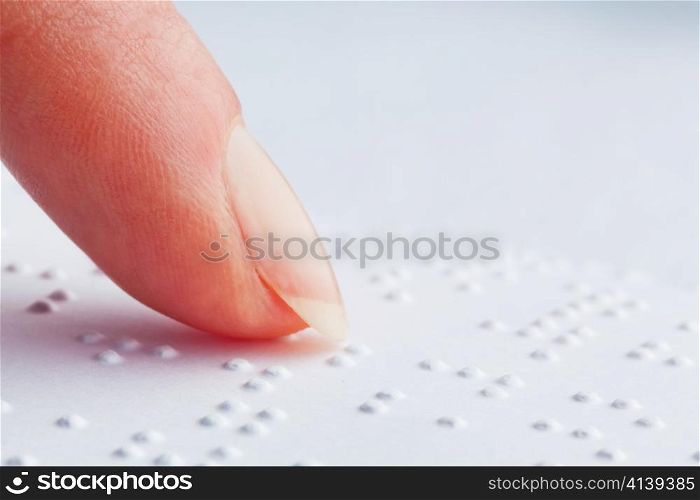 a book written in braille. braille for the blind.