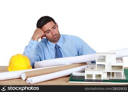 A bored architect at his desk.