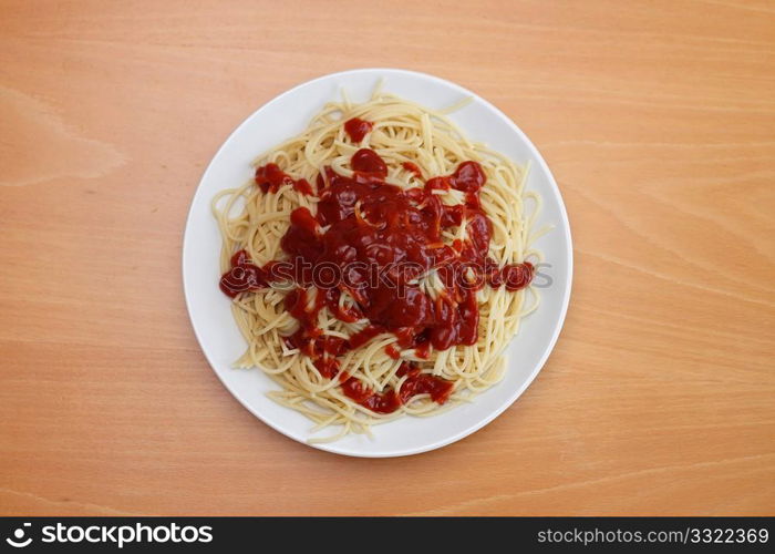 A boring plate of spaghetti with too much ketchup