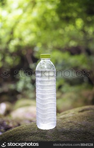 A Bottle of clean water, on the nature. Concept of a healthy lifestyle. A Bottle of clean water