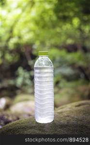 A Bottle of clean water, on the nature. Concept of a healthy lifestyle. A Bottle of clean water