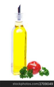 A bottle of olive oil with a young tomato and parsley. Shot on white background.