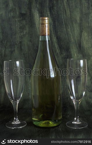 A bottle of wine and two glasses isolated on painted background