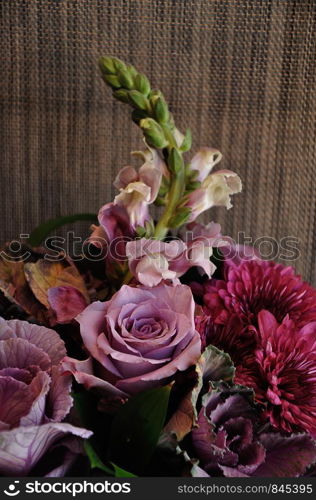 A bouquet of different type of purple flowers