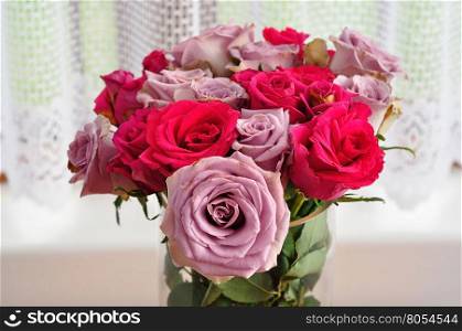 A bouquet of pink and purple roses