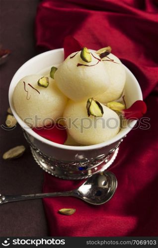 A bowl full with typical Indian sweet rasgulla, Pune, India