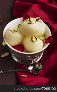 A bowl full with typical Indian sweet rasgulla, Pune, India