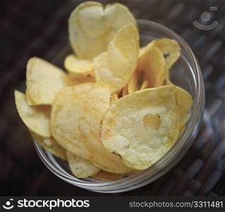 A bowl of potato crisps, served as a traditional accompaniement to drinks in British and European bars