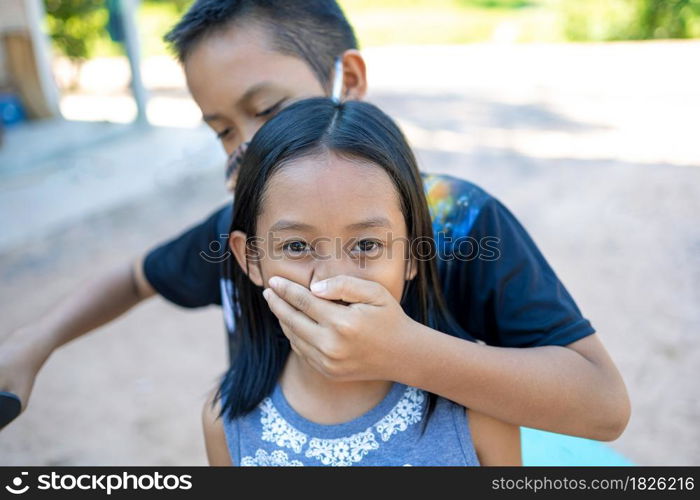 A boy and a girl play a hostage attacker.