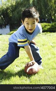 A boy having fun playing football