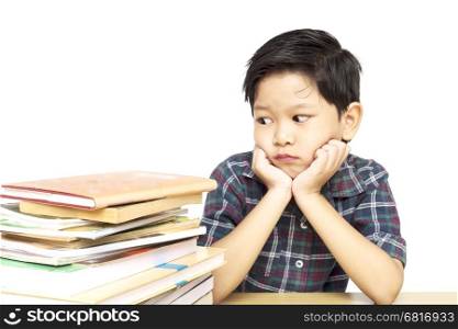 A boy is unhappy doing homework