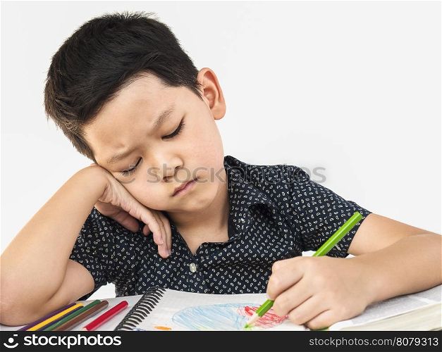 A boy is unhappy doing homework