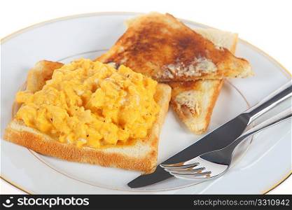 A breakfast of scrambled egg on toast, isolated on a white background.