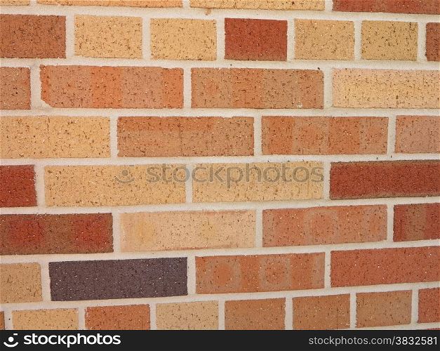 A brick wall with different color bricks