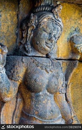 A Buddha encarved in stone at temple of Borobudur Indonesia