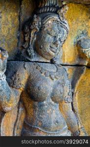 A Buddha encarved in stone at temple of Borobudur Indonesia
