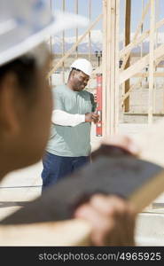 A builder using a spirit level