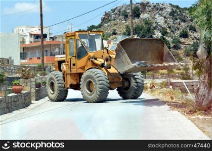 A bulldozer across the road on the island of Crete.