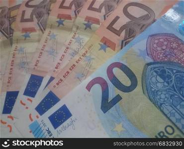 A bunch of 20 and 50 Euro banknotes