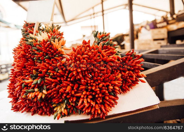 a bunch of crispy chili peppers on the market