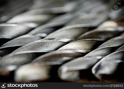A bunch of drill bits. Macro background. High quality photo. A bunch of drill bits.