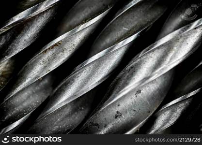 A bunch of drill bits. Macro background. High quality photo. A bunch of drill bits.