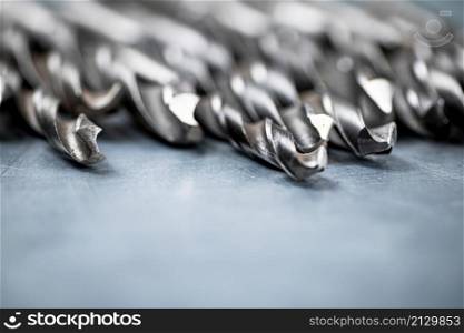 A bunch of drilled on the table. On a gray background. High quality photo. A bunch of drilled on the table.
