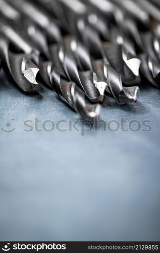 A bunch of drilled on the table. On a gray background. High quality photo. A bunch of drilled on the table.