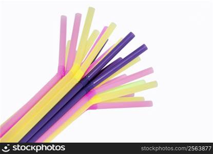 a bunch of drinking straws different color