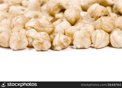 A bunch of hazelnuts on a white background