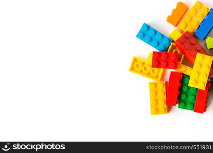 A bunch of Multicolor Plastick constructor bricks on white background. Popular toys. Copyspace. Bunch of many Colorful Plastick constructor bricks on white background. Popular toys. Copyspace