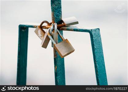 A bunch of padlocks symbolizing love for ever on a wall