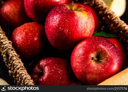A bunch of red apples with leaves. Macro background. High quality photo. A bunch of red apples with leaves.