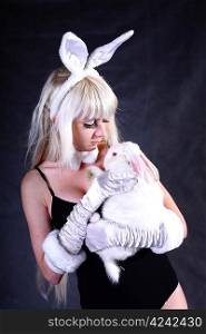 A bunny dressed girl studio shooting on gray background
