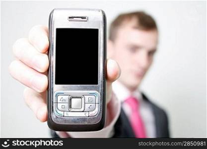 A business man holding a phone