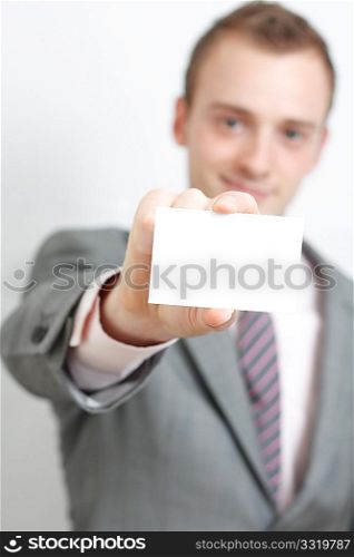A business man offering you his business card