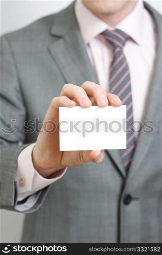 A business man offering you his business card