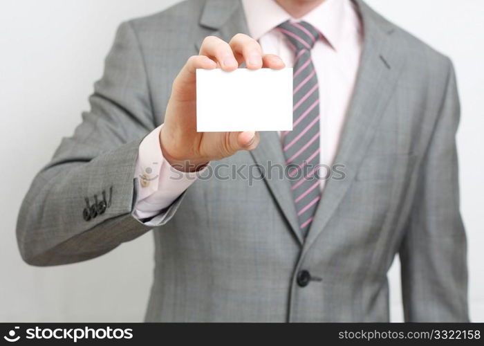 A business man offering you his business card