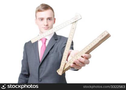 A business man with a folding ruler
