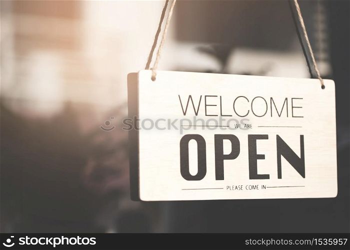 A business sign that says ?Open&rsquo; on cafe or restaurant hang on door