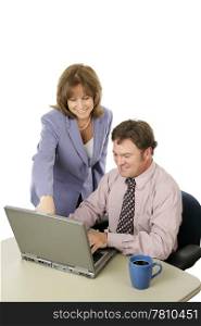 A business team working on the computer. The female is in charge. Isolated on white.