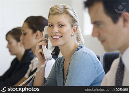 A business woman on the phone smiling