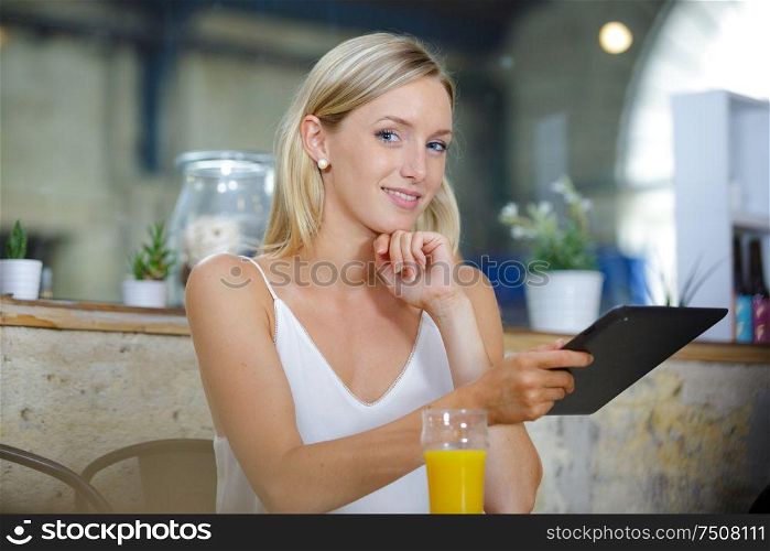 a business woman using a tablet