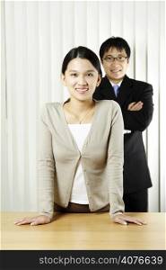 A businessman and a businesswoman in an office