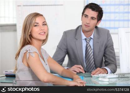 A businessman and a female customer in an office.
