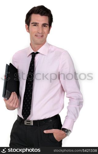 A businessman carrying a folder.