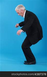 A businessman dancing.