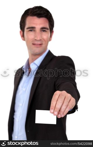 A businessman handing his card.